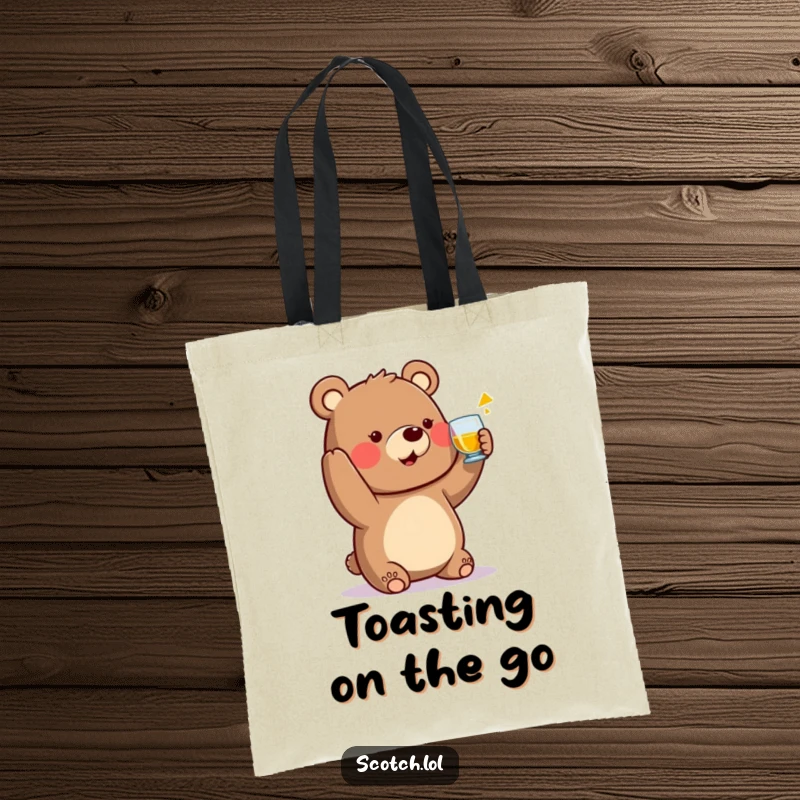 Funny Bear Tote Bag raising a small whisky glass in a toast, a humorous and practical accessory.
